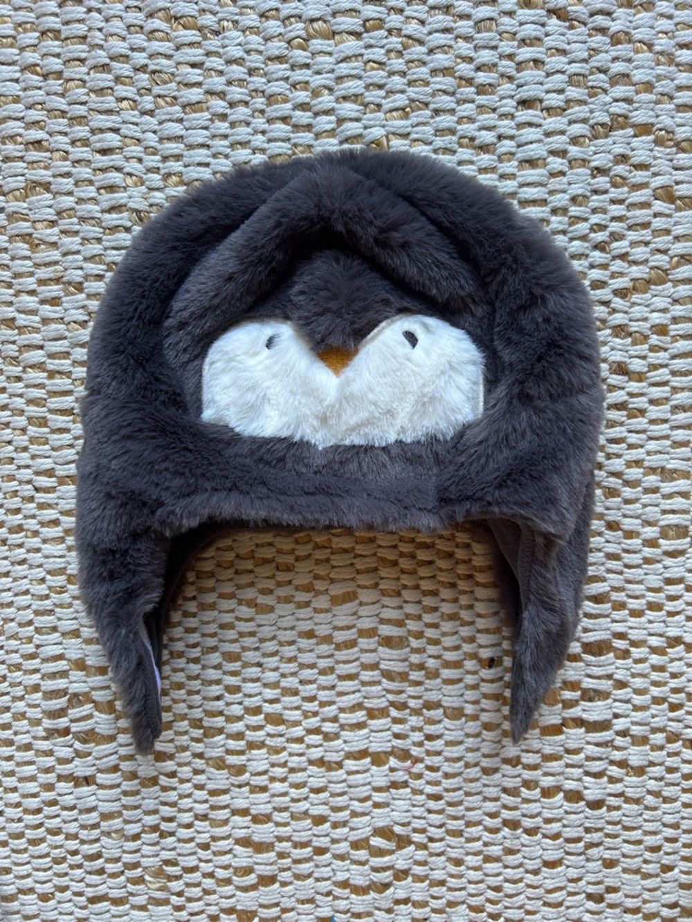 Carrer’s fuzzy penguin baby hat